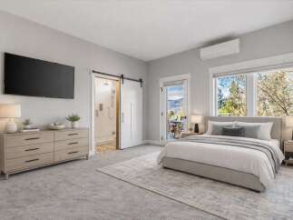 Step into luxury with this stunning bedroom featuring a modern design and ample natural light.
