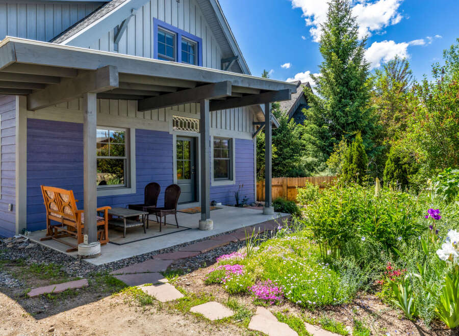 Charming home with a welcoming covered porch, perfect for enjoying the outdoors.