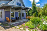 Charming home with a welcoming covered porch, perfect for enjoying the outdoors.