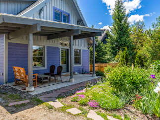 Charming home with a welcoming covered porch, perfect for enjoying the outdoors.