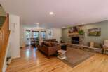 This stunning living space features a cozy fireplace, perfect for those chilly evenings.