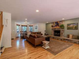 This stunning living space features a cozy fireplace, perfect for those chilly evenings.