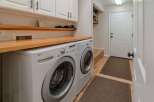 This laundry room boasts modern convenience and style.