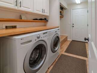 This laundry room boasts modern convenience and style.