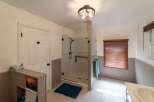 Step into this beautifully designed bathroom featuring a modern glass shower, perfect for a relaxing experience.