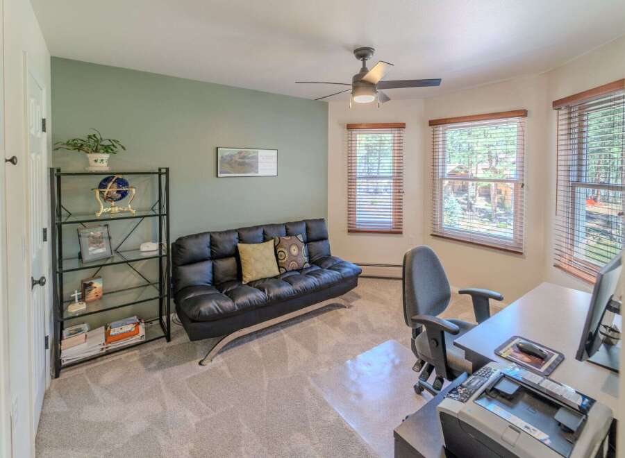 This versatile home office space offers a comfortable and functional environment.