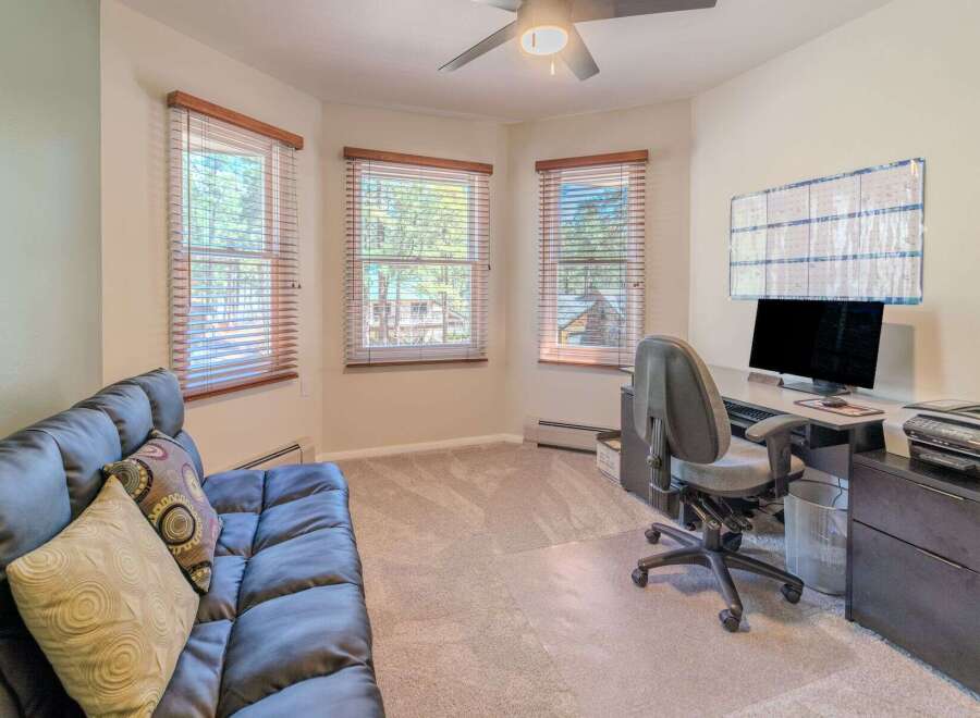 This inviting home office offers a bright and airy workspace, perfect for productivity.