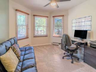 This inviting home office offers a bright and airy workspace, perfect for productivity.