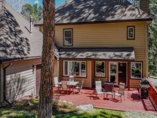 This stunning property boasts a spacious deck, perfect for outdoor entertaining and relaxation.