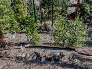 Escape to your own private oasis with this stunning property nestled in a serene, wooded setting.