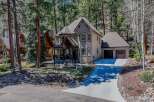 Nestled in a serene, wooded setting, this stunning property boasts a charming two-story home with a welcoming porch.