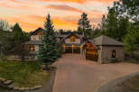 This stunning property boasts a beautiful exterior with a spacious driveway and a well-manicured lawn.
