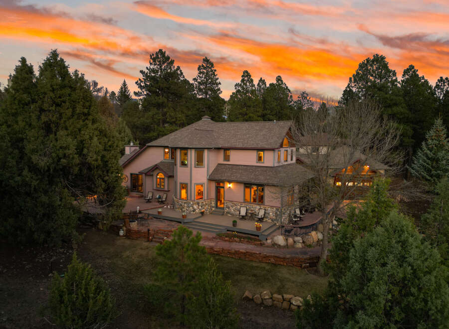 This stunning property boasts a beautiful exterior with a warm and inviting ambiance.