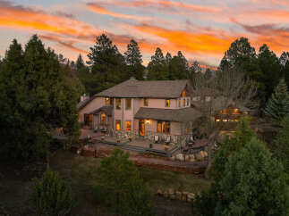 This stunning property boasts a beautiful exterior with a warm and inviting ambiance.