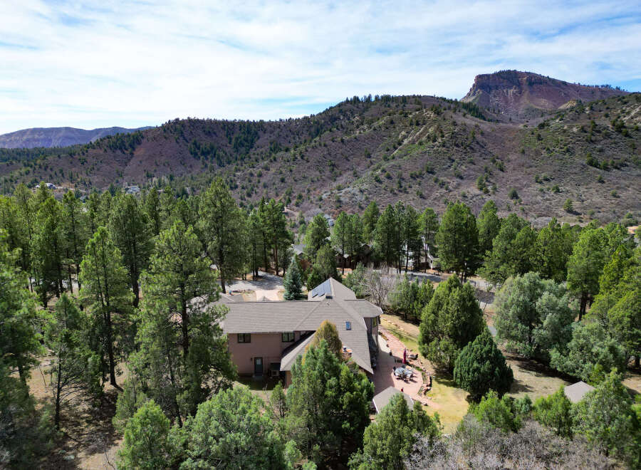 Nestled amidst lush greenery and majestic mountains, this stunning property offers a serene escape.