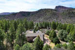 Nestled amidst lush greenery and majestic mountains, this stunning property offers a serene escape.