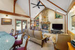 This stunning property boasts a cozy living room with a stone fireplace, perfect for those chilly evenings.