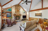 Step into luxury with this stunning property featuring a cozy stone fireplace, perfect for chilly evenings.