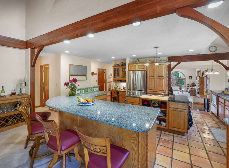 This stunning kitchen boasts a spacious layout, perfect for both cooking and entertaining.