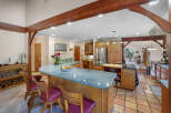 This stunning kitchen boasts a spacious layout, perfect for both cooking and entertaining.