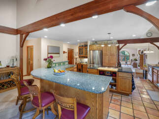 This stunning kitchen boasts a spacious layout, perfect for both cooking and entertaining.
