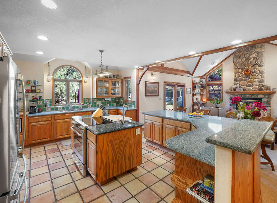 This stunning kitchen boasts a spacious layout, perfect for both cooking and entertaining.