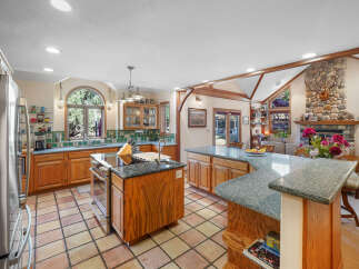 This stunning kitchen boasts a spacious layout, perfect for both cooking and entertaining.