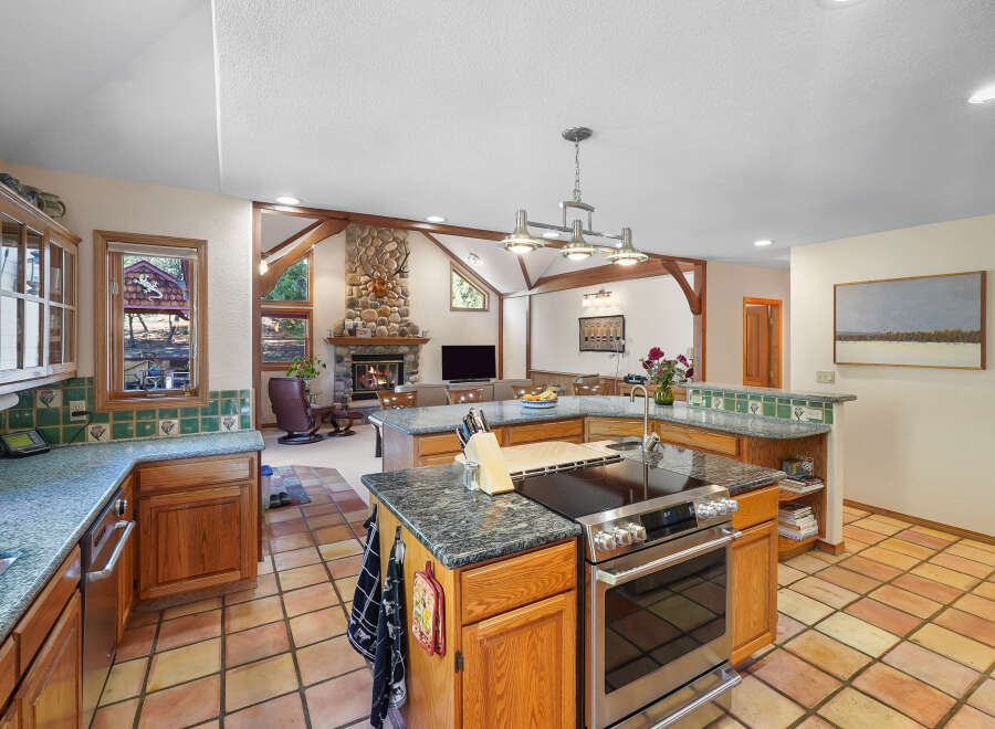 This stunning kitchen boasts a spacious layout with a large island, perfect for culinary creations and entertaining.