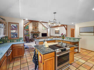 This stunning kitchen boasts a spacious layout with a large island, perfect for culinary creations and entertaining.
