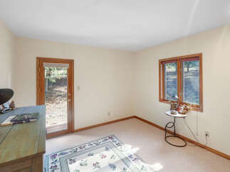 This inviting room features a neutral color palette, creating a bright and airy atmosphere.