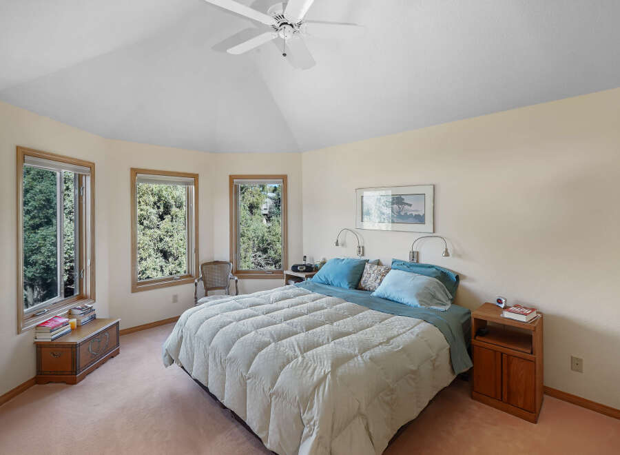 This inviting bedroom offers a serene retreat with its soft color palette and natural light.