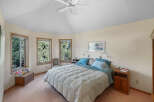 This inviting bedroom offers a serene retreat with its soft color palette and natural light.