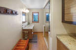 This stunning bathroom boasts a modern design with a touch of rustic charm.