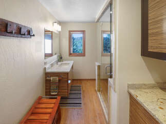 This stunning bathroom boasts a modern design with a touch of rustic charm.