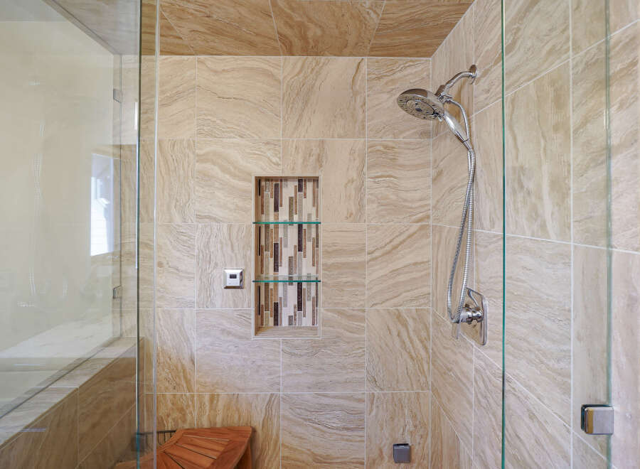 Step into a luxurious bathroom oasis with this stunning shower.