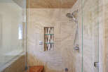 Step into a luxurious bathroom oasis with this stunning shower.