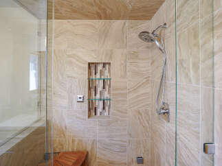 Step into a luxurious bathroom oasis with this stunning shower.
