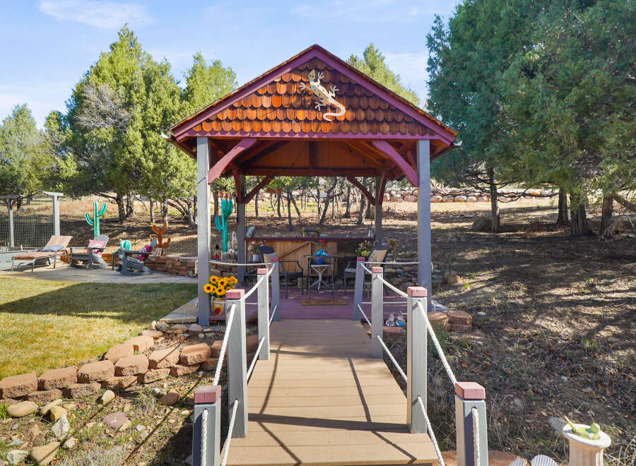 Discover the charm of this unique property featuring a beautifully crafted gazebo, perfect for outdoor relaxation and entertaining.