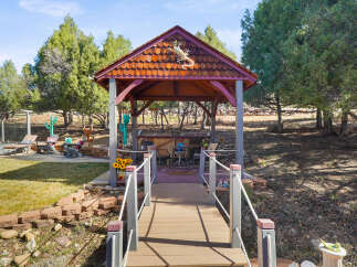Discover the charm of this unique property featuring a beautifully crafted gazebo, perfect for outdoor relaxation and entertaining.