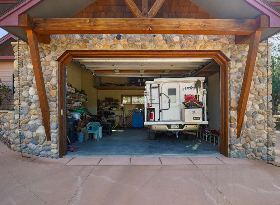 Discover the charm of this unique property featuring a stunning stone facade and a spacious garage.