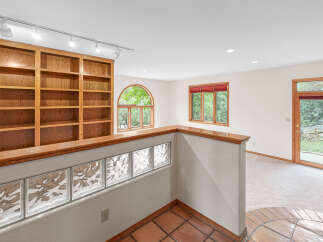 Discover this charming home featuring a spacious built-in bookshelf, perfect for displaying your favorite reads.