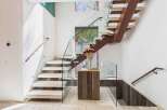 This stunning staircase showcases modern design with its floating steps and glass railings.