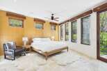 Experience luxury in this stunning bedroom featuring a modern design and natural light.