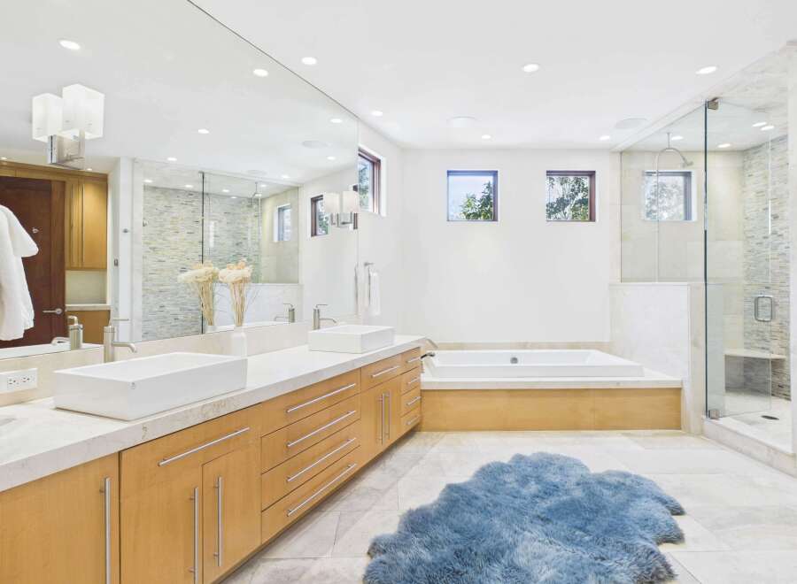 This luxurious bathroom boasts a modern design with a spacious layout.