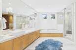 This luxurious bathroom boasts a modern design with a spacious layout.