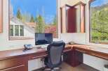 This stunning home office boasts a bright and airy atmosphere, perfect for productivity.