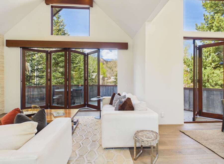 Experience luxury living in this stunning property featuring expansive windows that flood the space with natural light.
