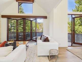 Experience luxury living in this stunning property featuring expansive windows that flood the space with natural light.