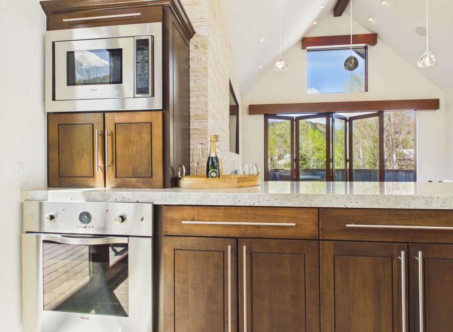 This stunning kitchen boasts modern appliances and elegant cabinetry, perfect for culinary enthusiasts.