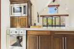 This stunning kitchen boasts modern appliances and elegant cabinetry, perfect for culinary enthusiasts.